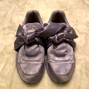 Purple Rihanna sneakers with bow